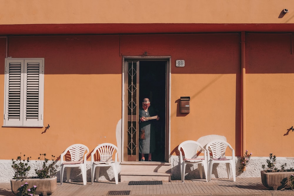 person standing beside door