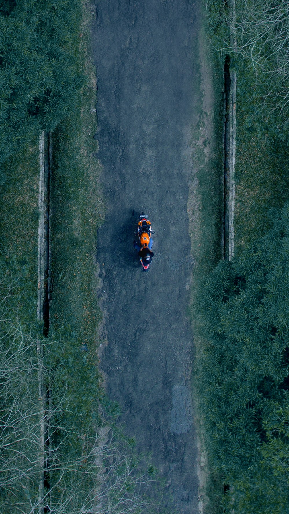 aerial photography of motorcycle on black pathway