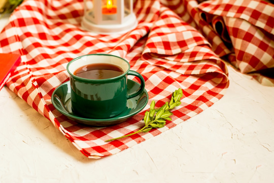 green ceramic teacup