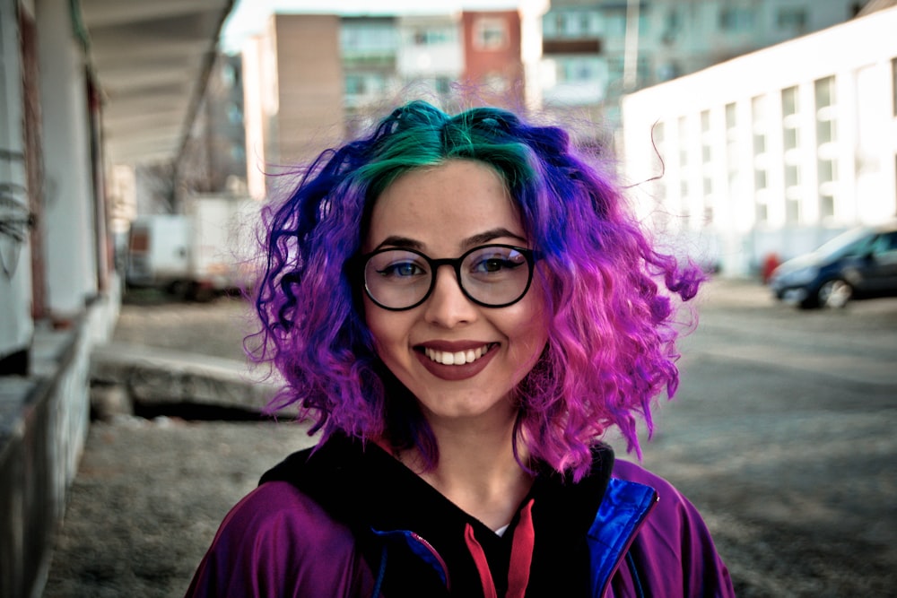 selective focus photo of woman in purple jacket