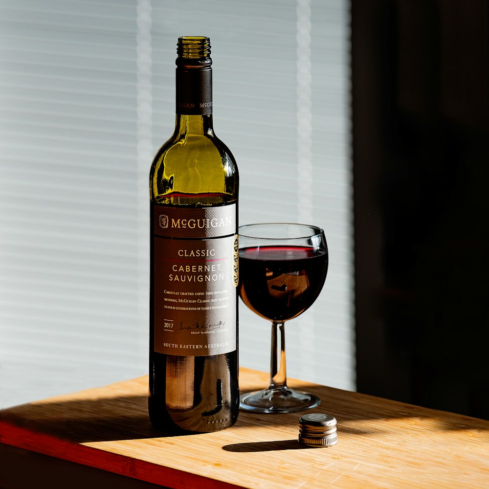 Cabernet Sauvignon wine bottle beside wine glass