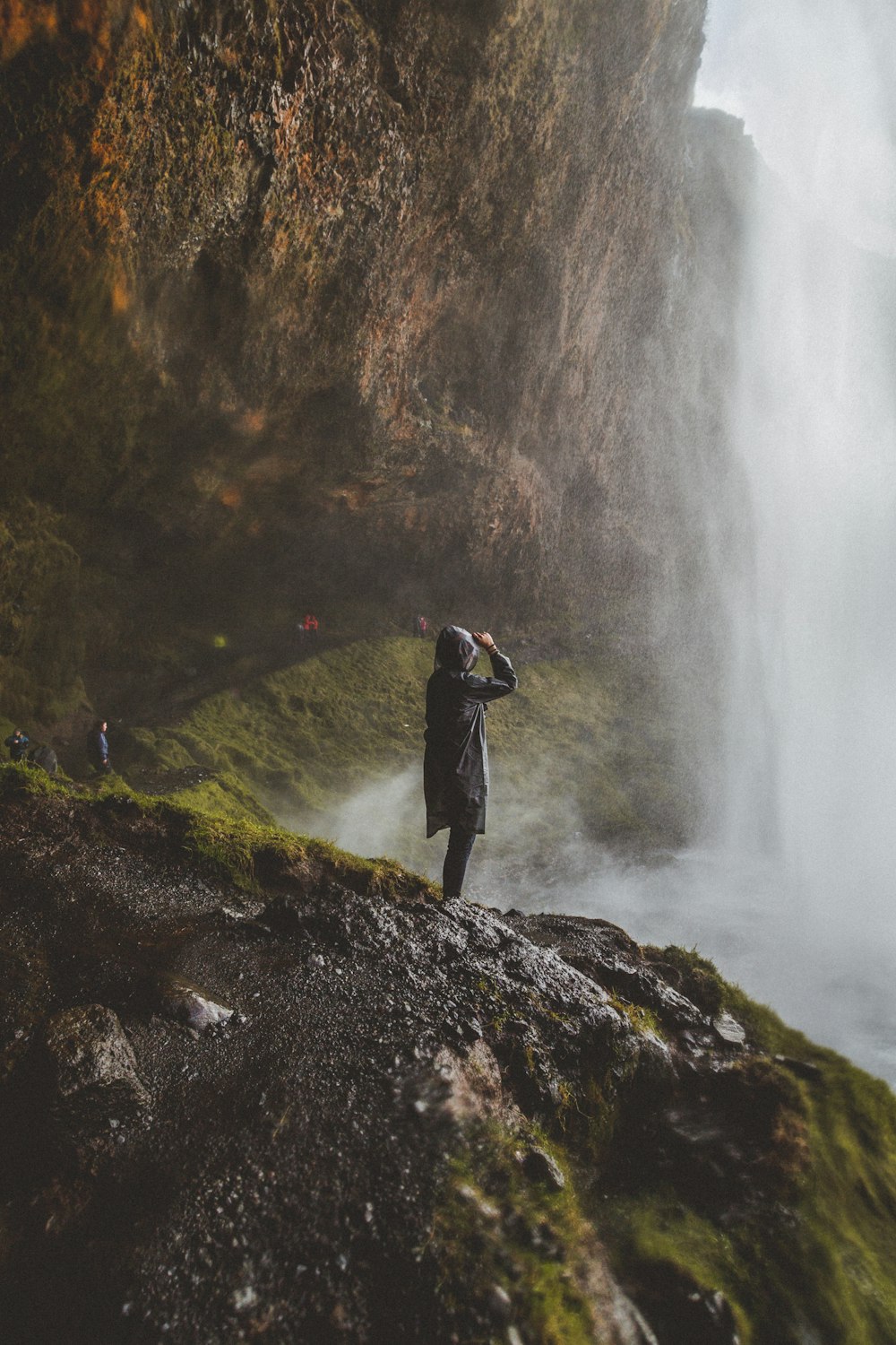 person standing on rock formation