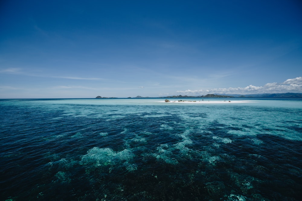 small island under clear sky