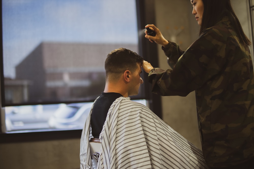 woman praying gel mans hair