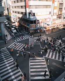 Student confidently navigating a busy city intersection during a lesson.