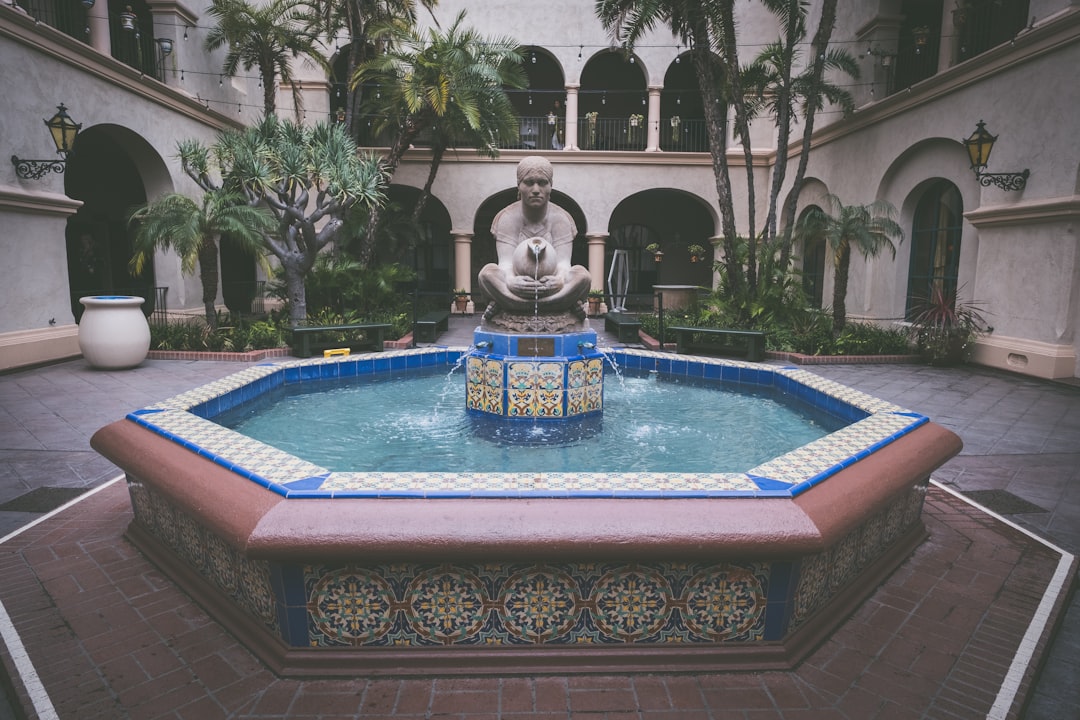 water fountain with statue between it,