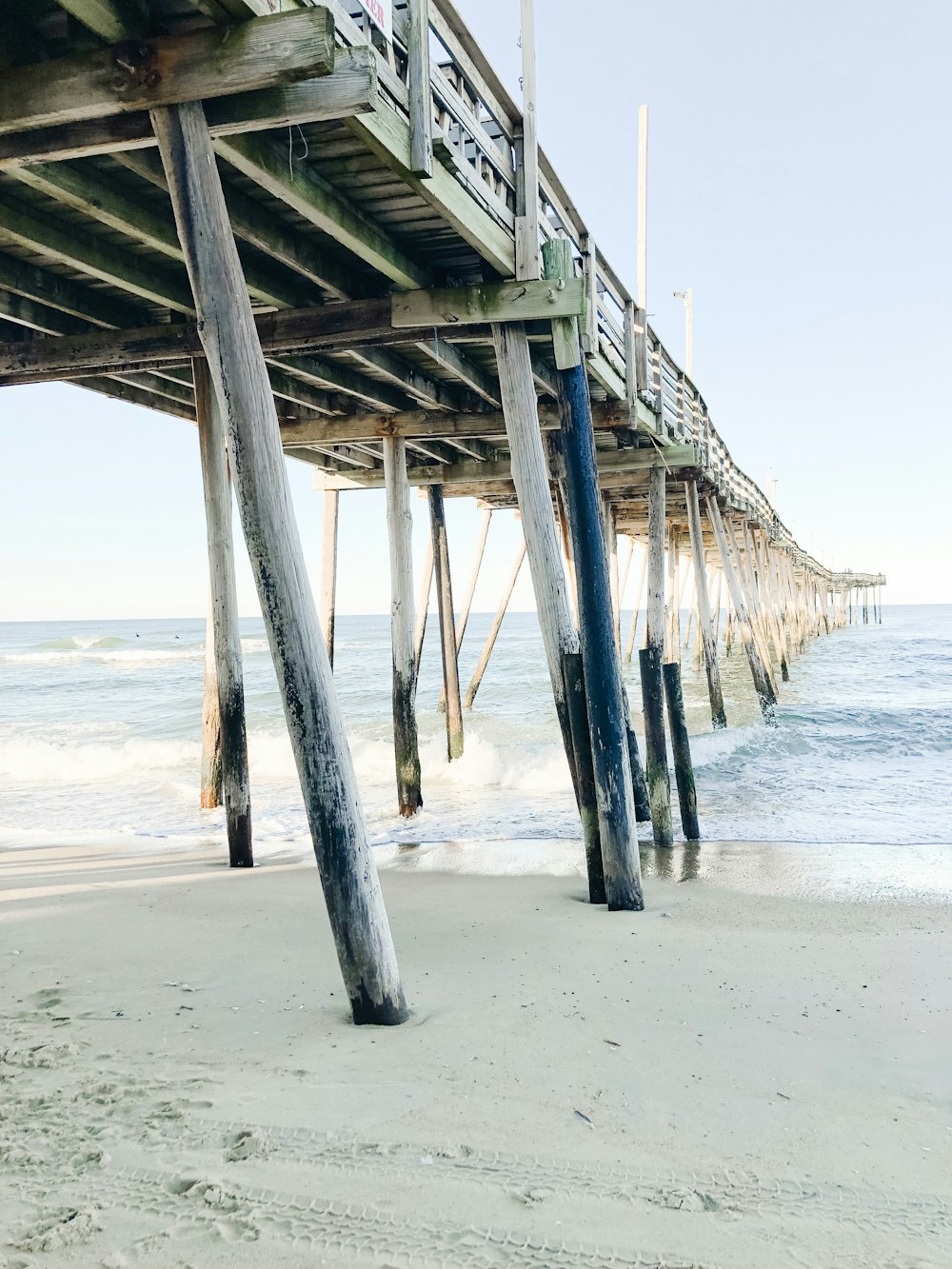 gray wooden bridge during daytime