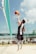 man about to hit the ball at volley court
