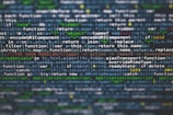 Lines of JavaScript code displayed on a computer screen with syntax highlighting. The text includes various functions, variables, and operations related to web development.