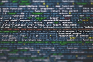 Lines of JavaScript code displayed on a computer screen with syntax highlighting. The text includes various functions, variables, and operations related to web development.