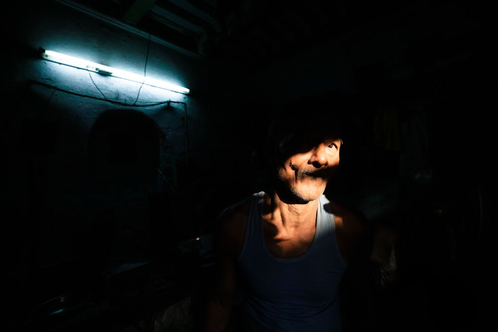 man with face being hit by light