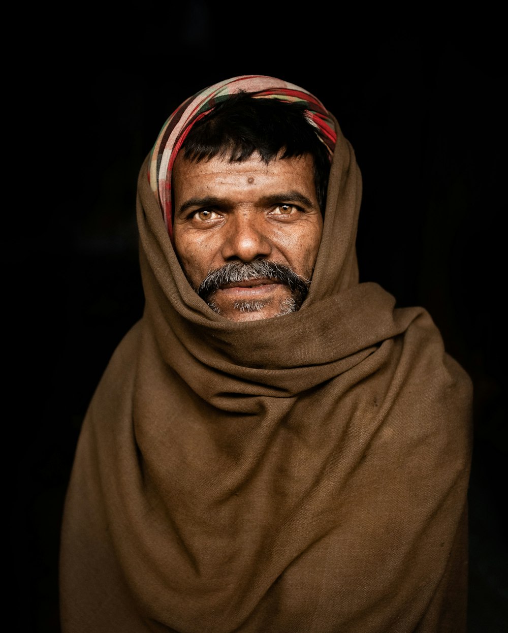 portrait of man wearing black hijab