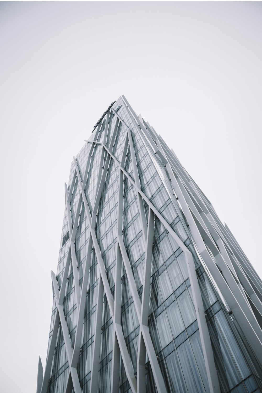 low angle photography of high-rise building under cloudy sky