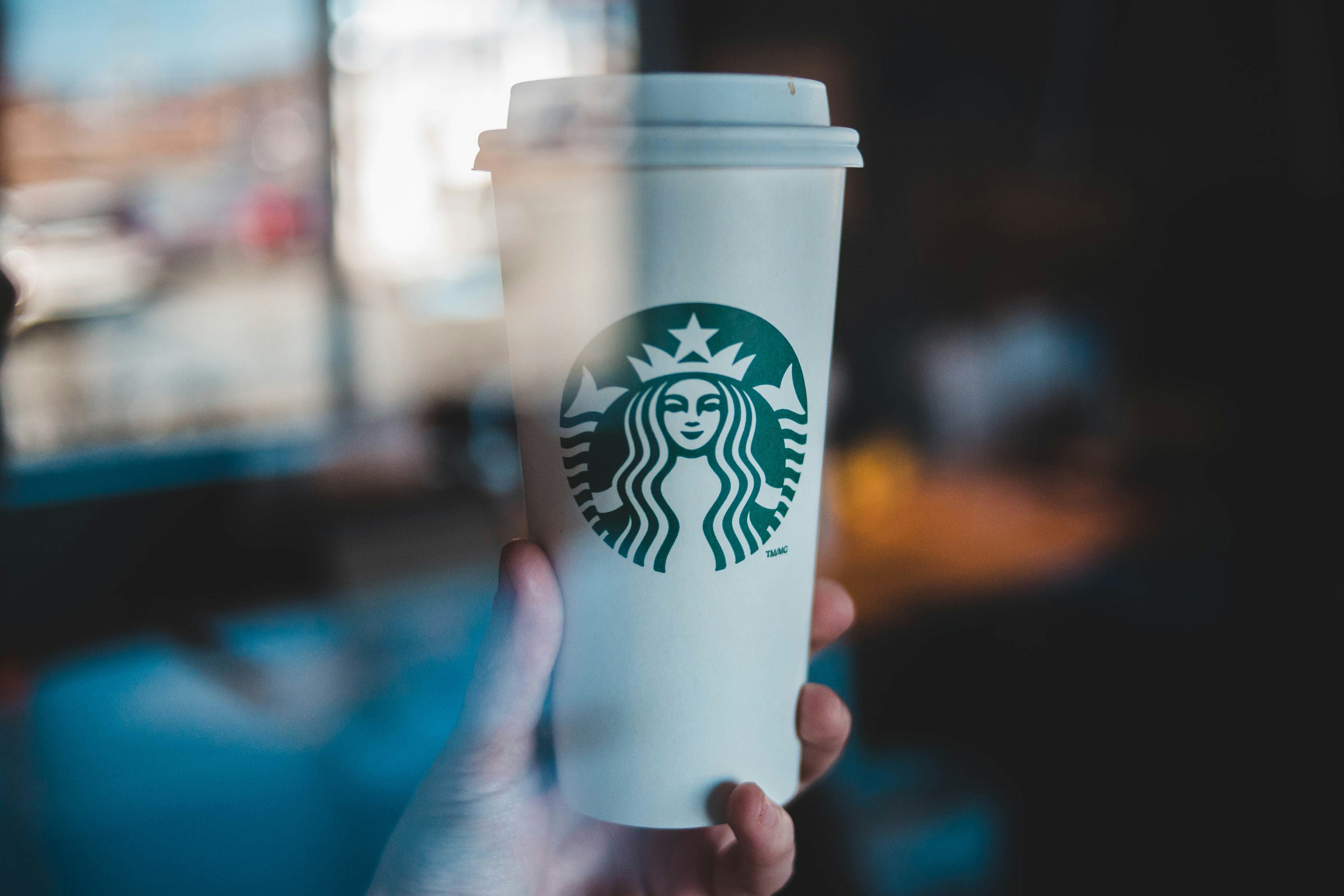 Person Holding Starbucks Coffee Cup Photo Free Coffee Cup Image On Unsplash