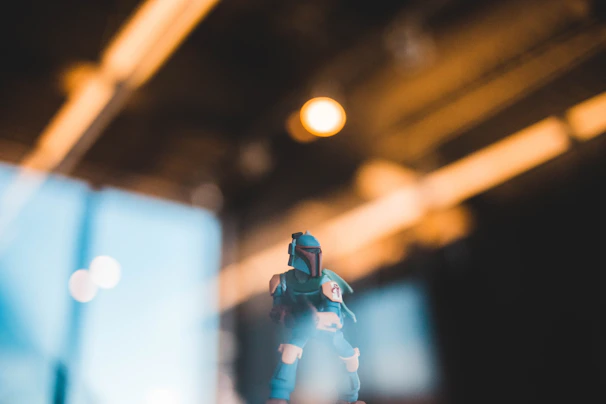 A minimalist display highlighting a single collectible figure against a soft, blurred background.