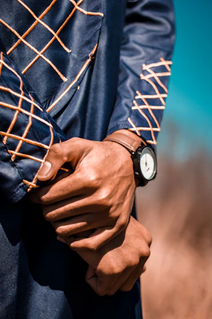 Close-up of hands locking a wrist hold as part of a systema self-defense drill.