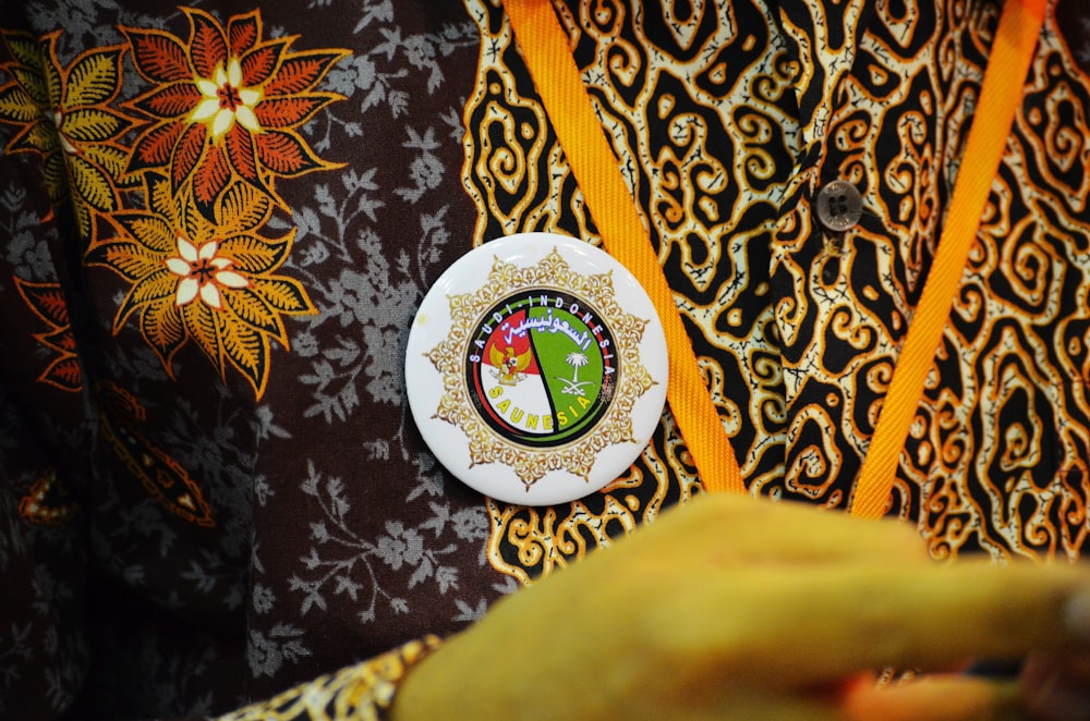a close up of a person's shirt with a badge on it