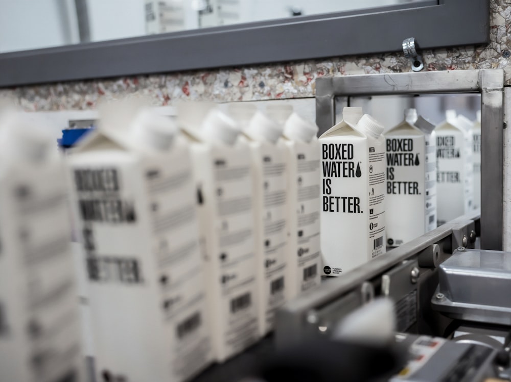 White Boxed Water container on a conveyor belt