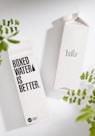 Two Boxed Water cartons on a white surface