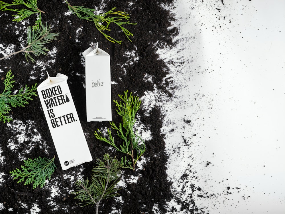 Boxed Water cartons on the black and white ground