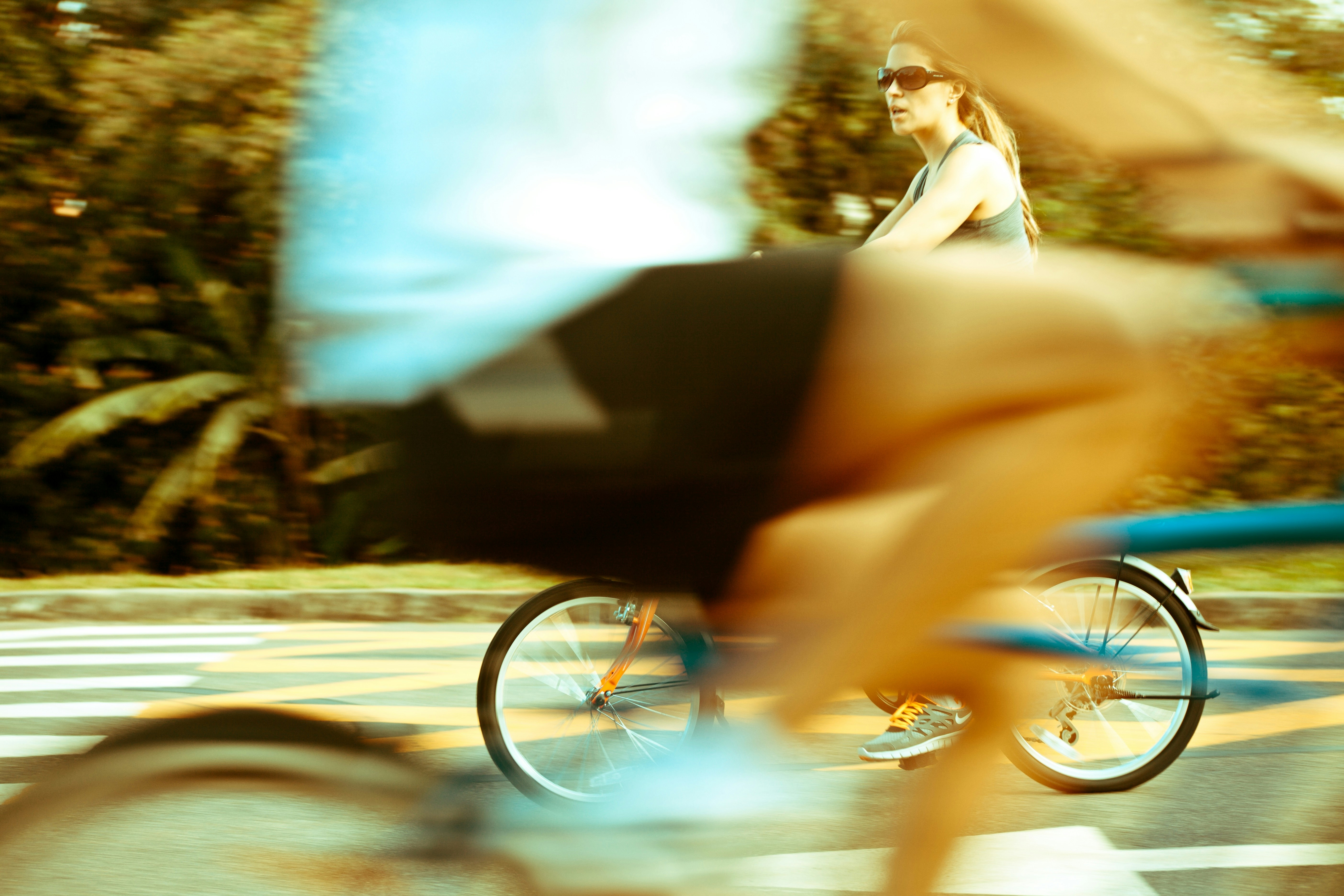 woman in orange bicycle