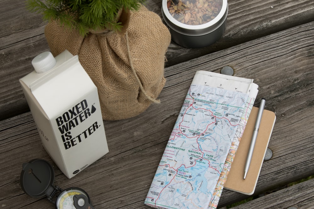 A map next to a Boxed Water carton