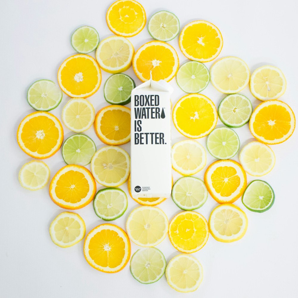 Sliced citrus fruits and a Boxed Water carton