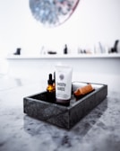selective focus photo of Smooth Hands soft-tube in rectangular gray tray