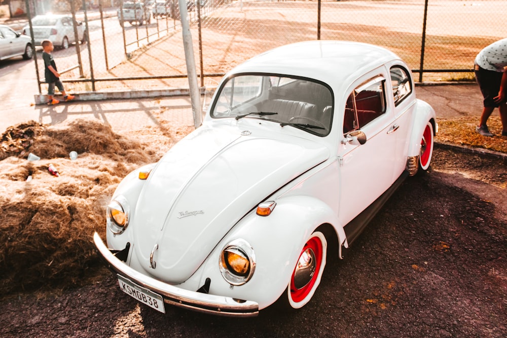 classic white Volkswagen Beetle coupe during daytime