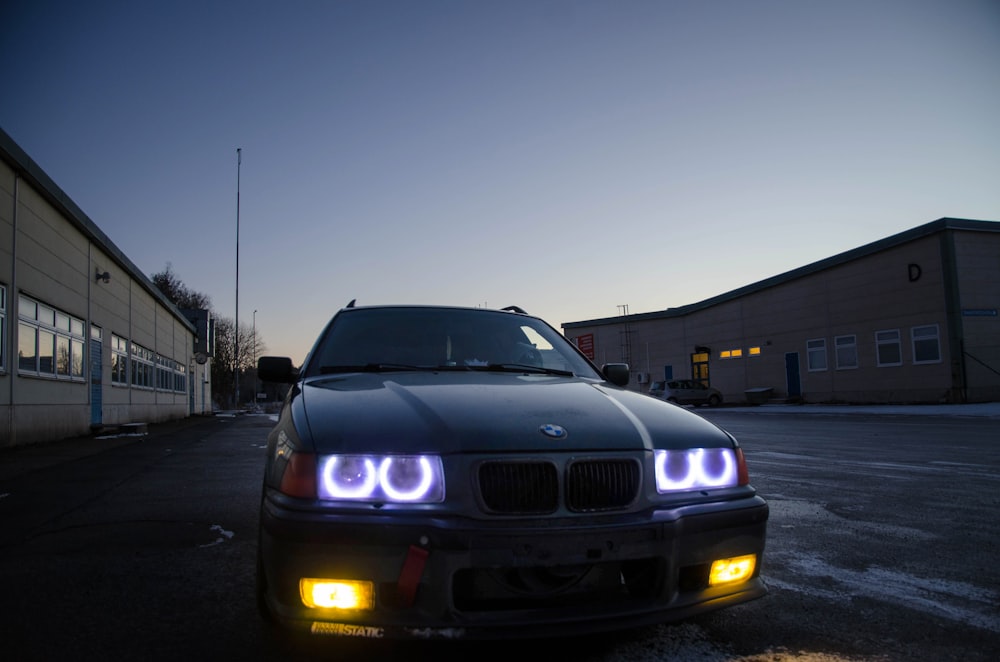 black BMW vehicle on road