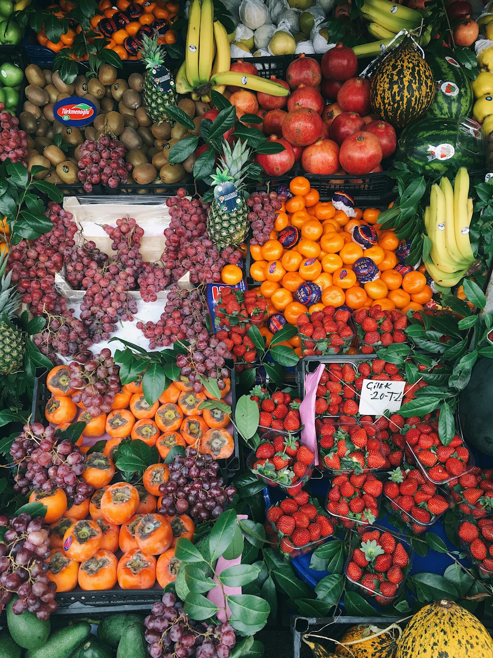 a large display of fruits and vegetables for sale