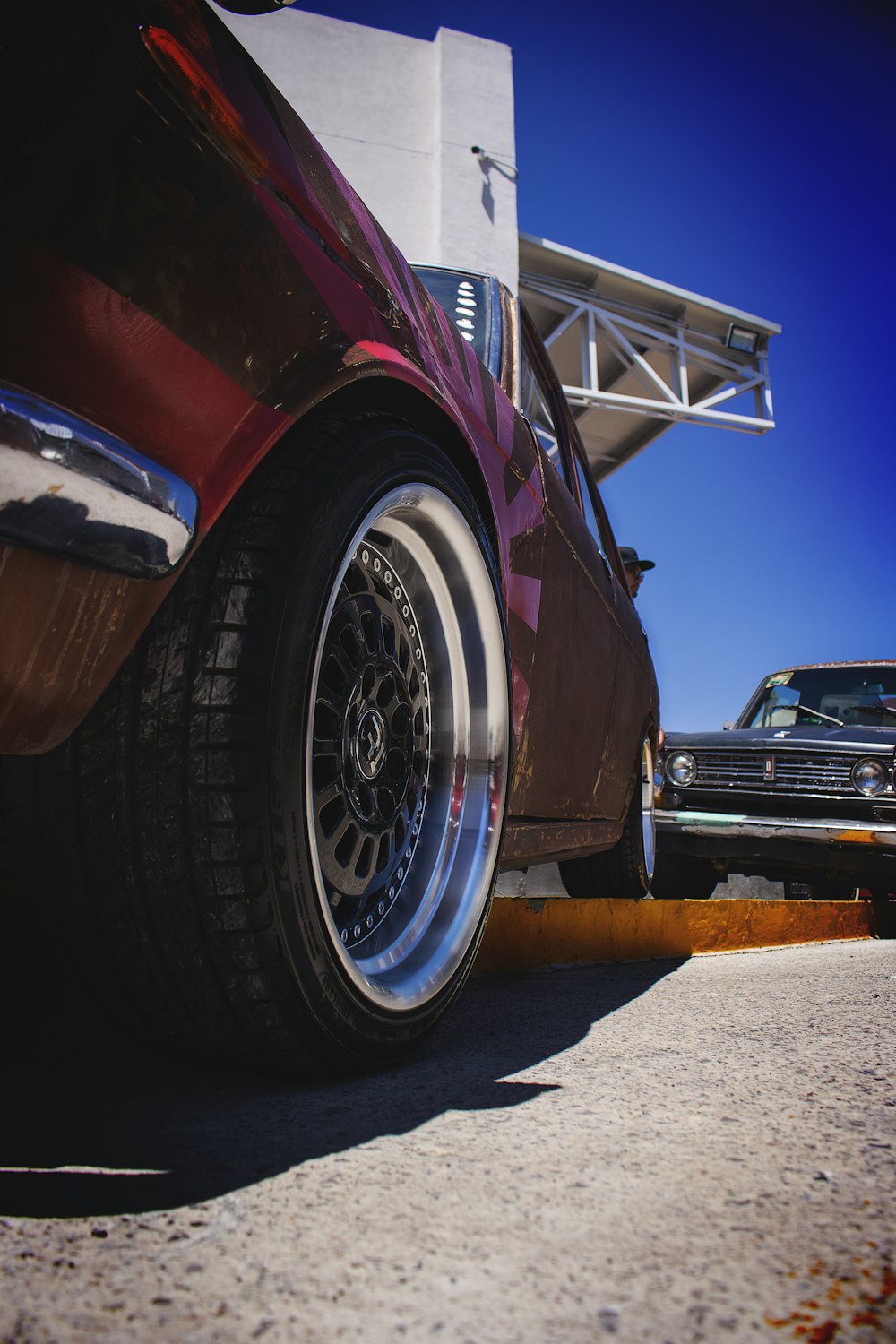 low-angle photography of red car