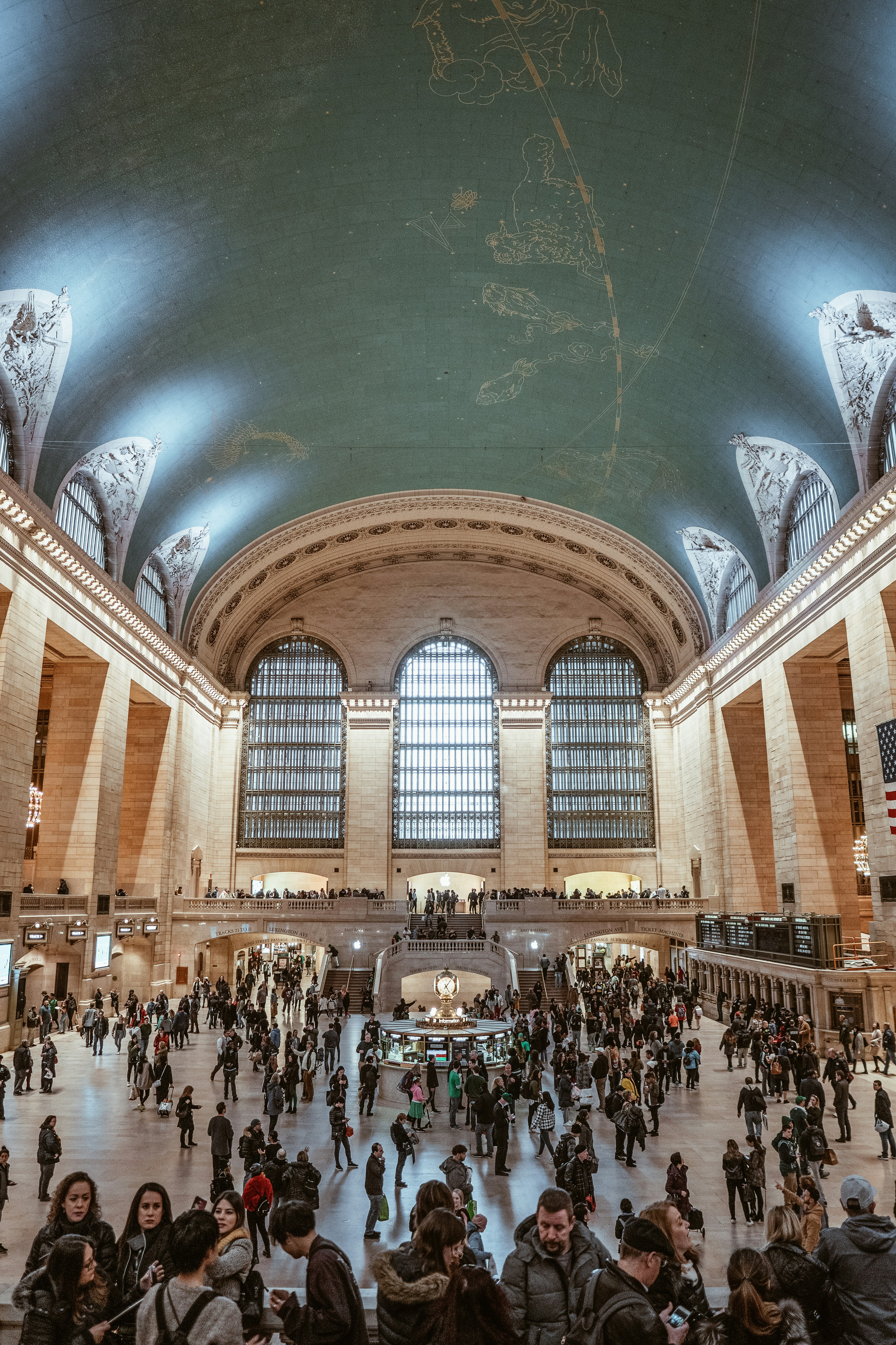 people standing under musuem