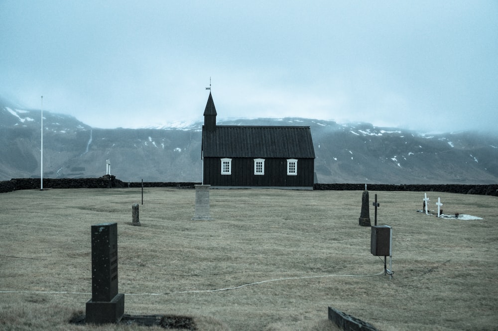 black building near graveyard