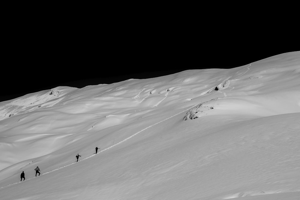 people standing on snow mountain during daytime