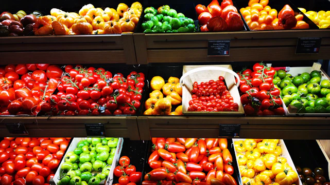 assorted fruits on display in shelves