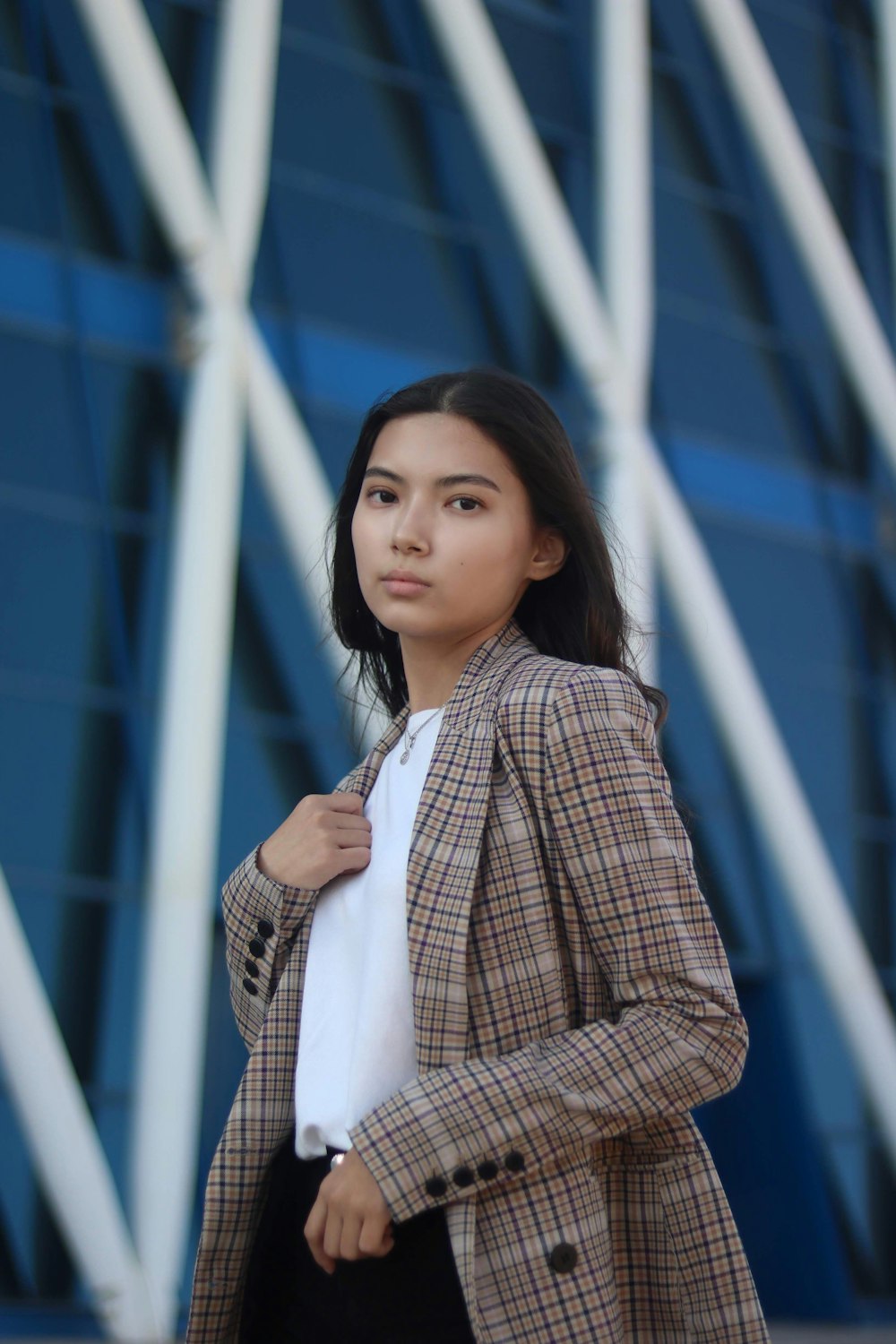 woman in brown jacket and white shirt