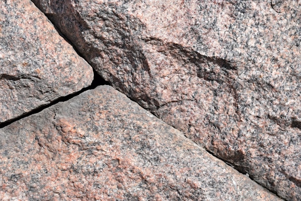 Close-up of polished granite slabs stacked in a warehouse