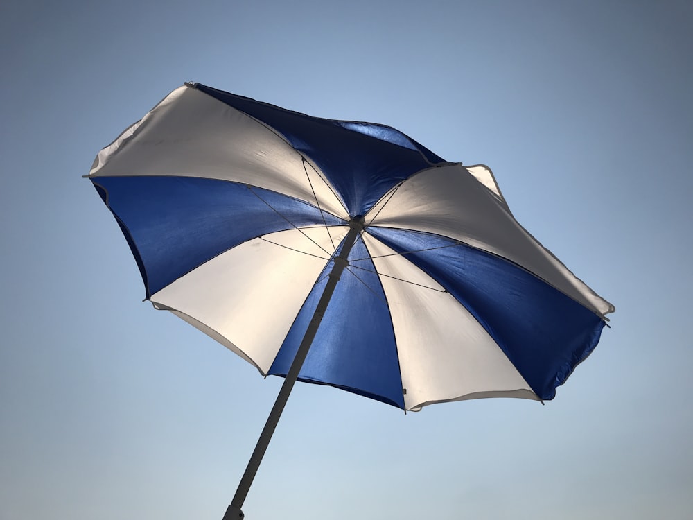 white and blue patio umbrella