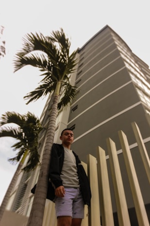 A confident man standing tall with a warm smile, symbolizing personal growth.