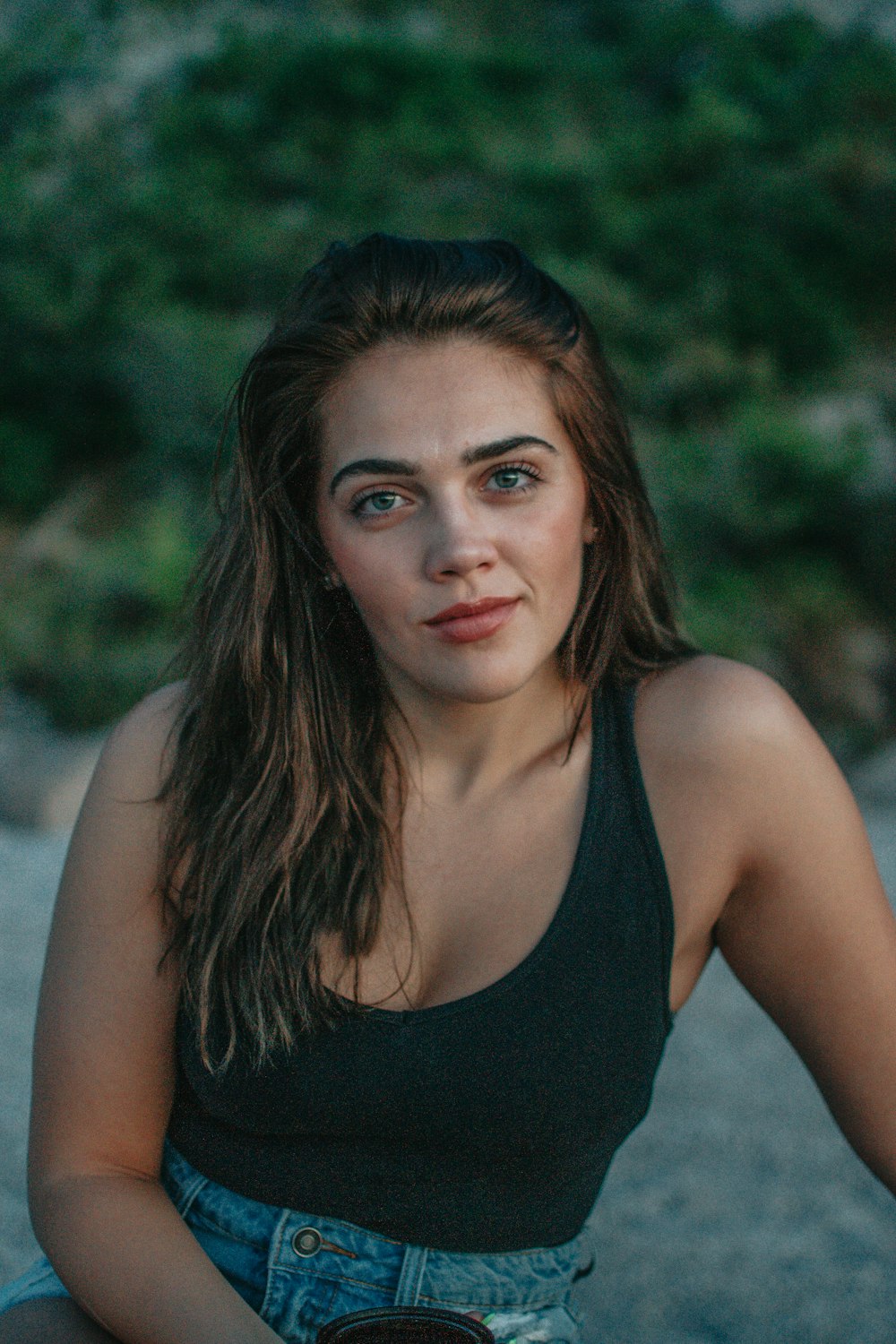 smiling woman wearing green tank top