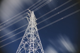 low-angle photography of transmission tower