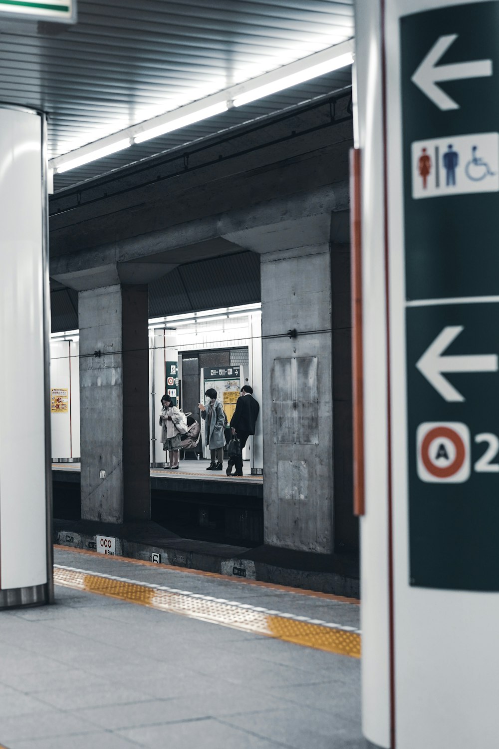 person standing near railway