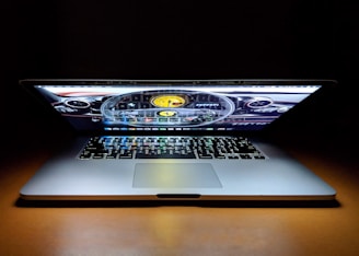 Close-up of a laptop screen showing a vehicle registration input box on a sleek navy blue interface.