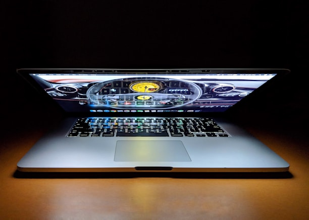 A close-up of a laptop screen displaying vehicle status and challan information.