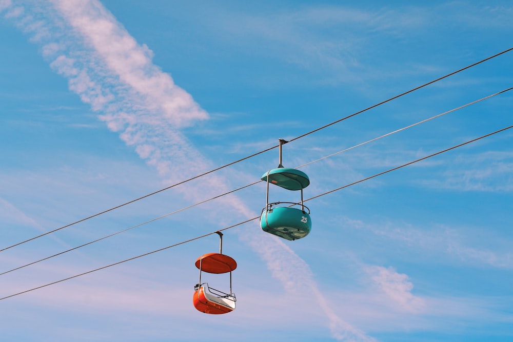 two blue and red cable cars