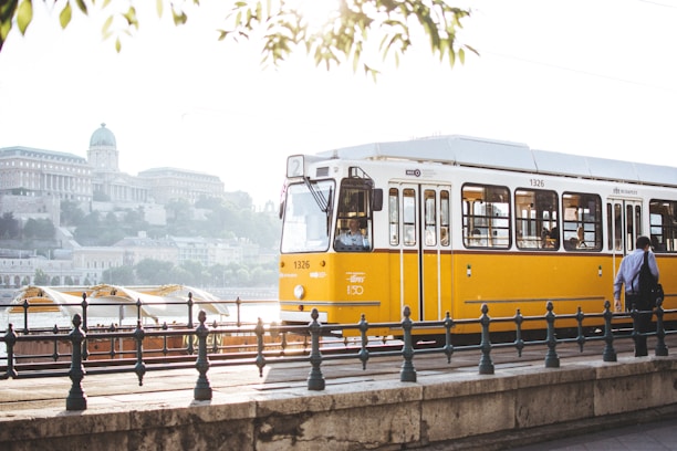 man standing in front of yellow train