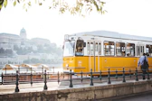 man standing in front of yellow train
