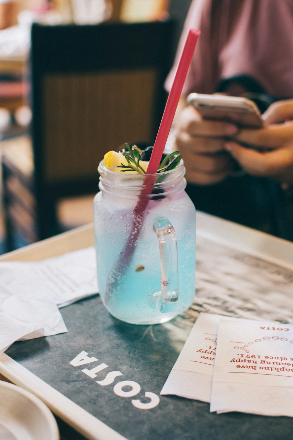 clear glass mug filled with blue liquid