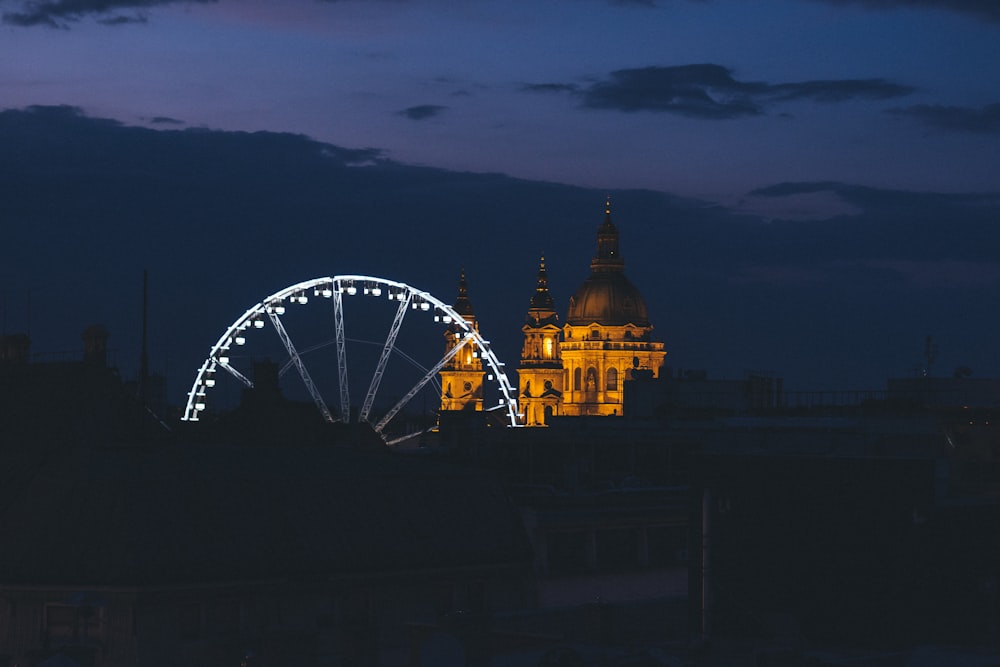 high-angle photography of mosque near Ferris wheel